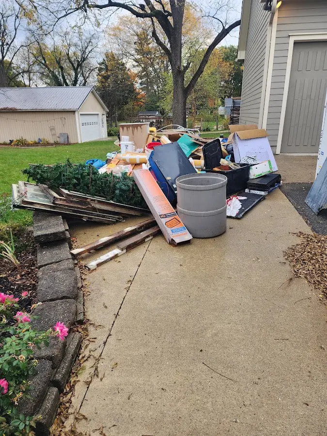Dumpster being loaded with debris for 3 Yard Dumpster Rental in Chili